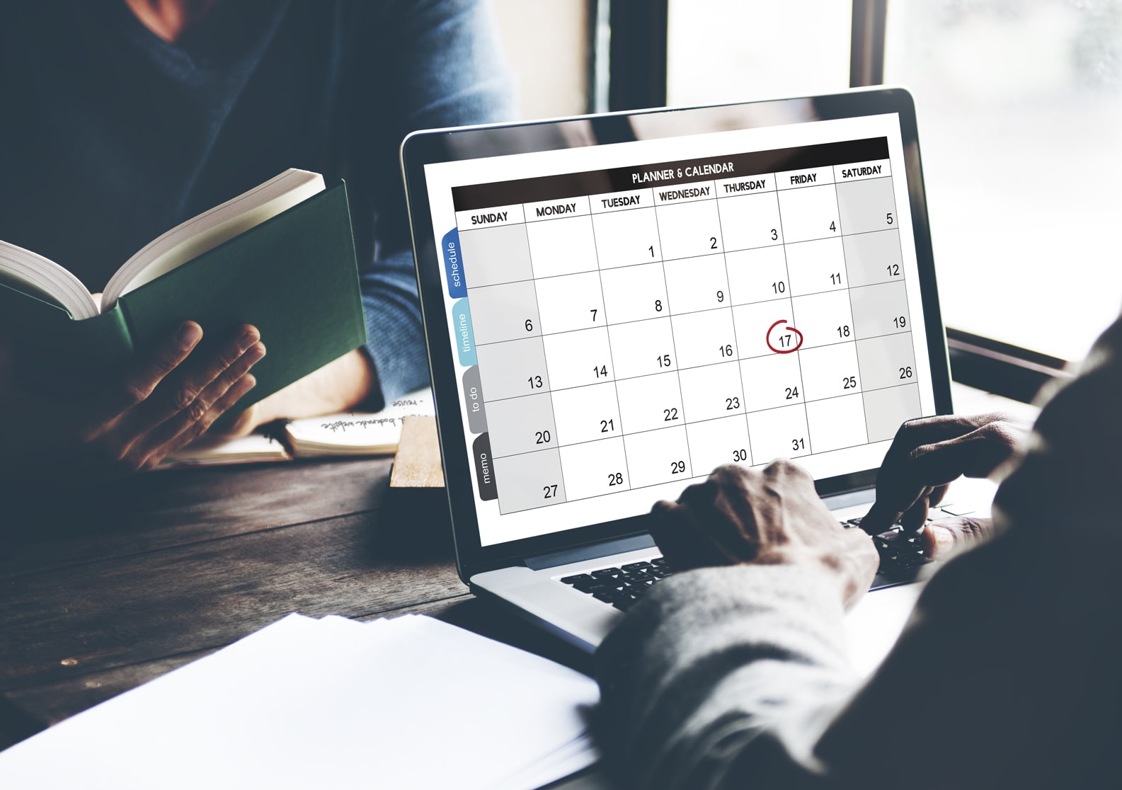 Figure of a man planning his appointments and events with an online calendar.