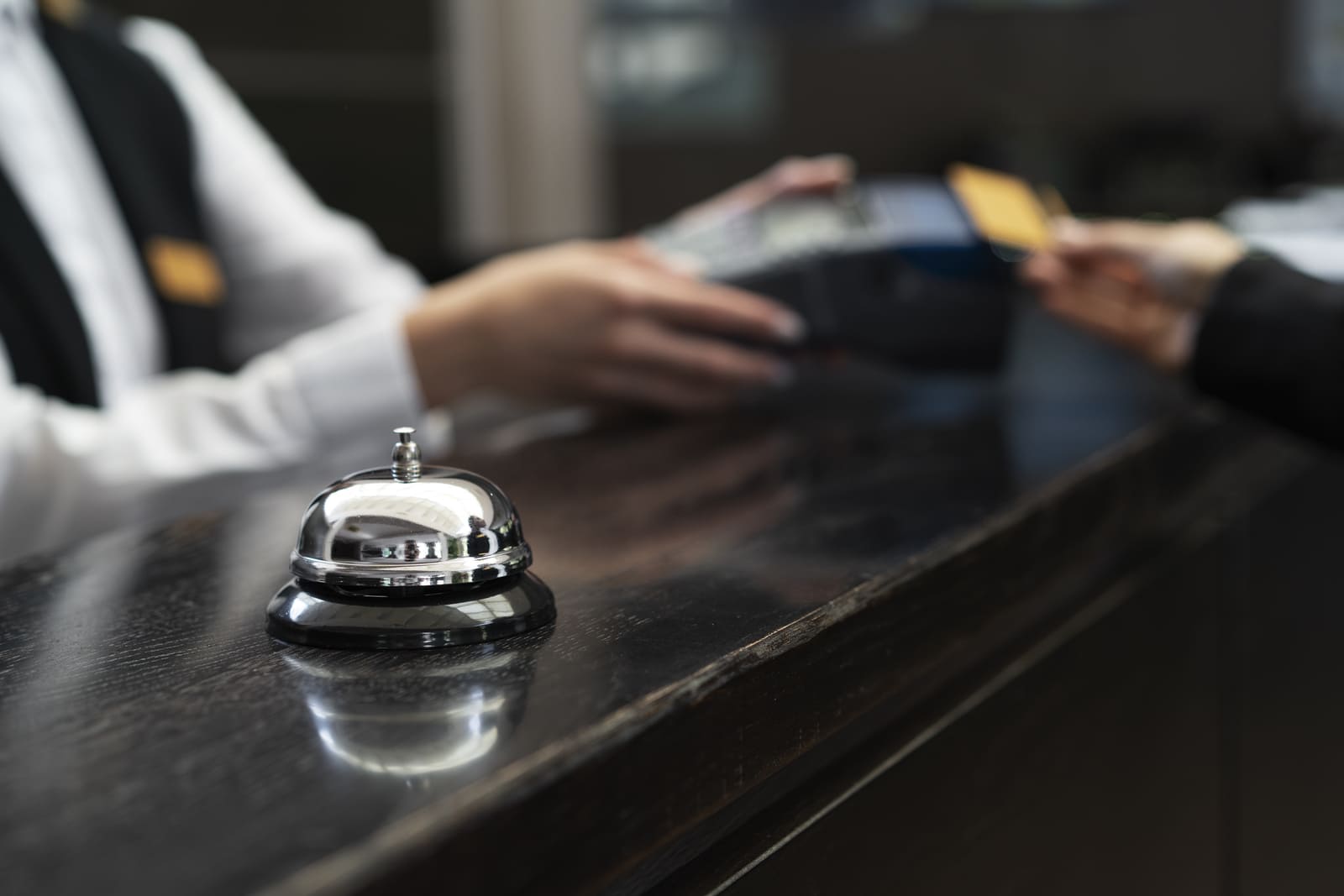 Picture of hotel reception, a hospitality business using a hotel cancellation policy.