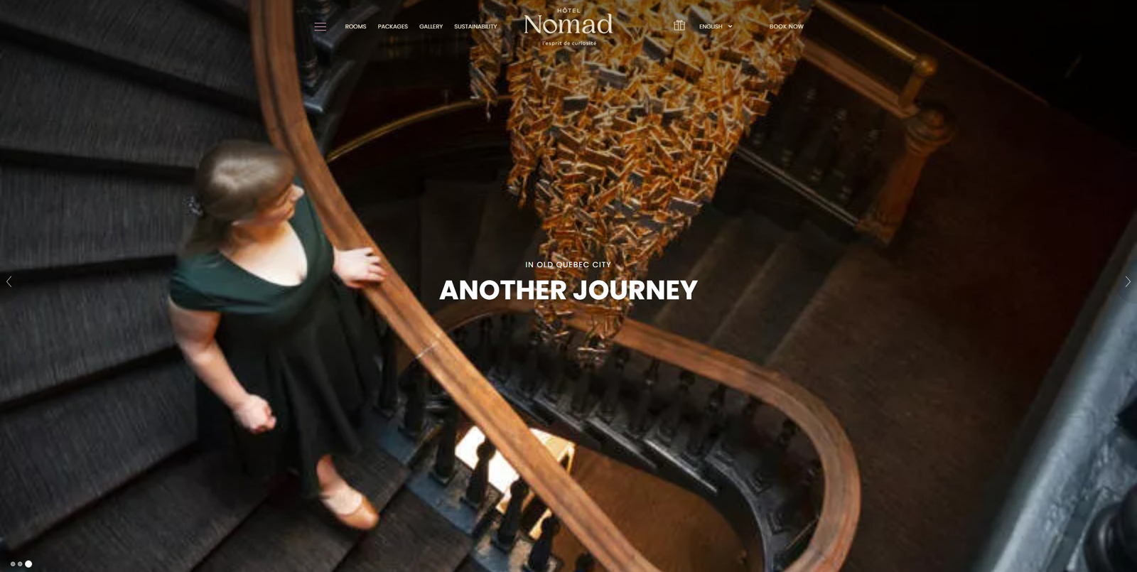 View of Hôtel Nomad, boutique hotel website design with multiple pricing packages.