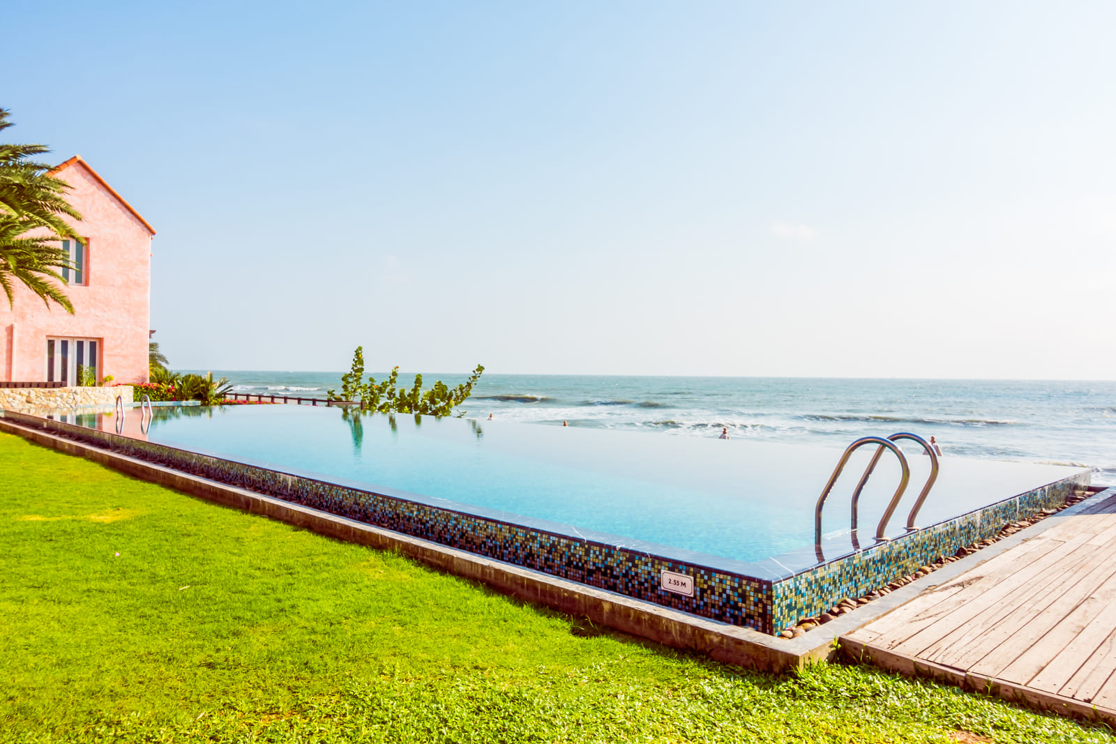 Portrait of a swimming pool that is a part of amenities mentioned in the vacation rental house rules template.